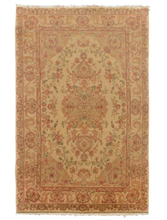This is a Tabriz Hand Made Area Rug from China. It measures about 4 by 6 and is available at our online rug store.