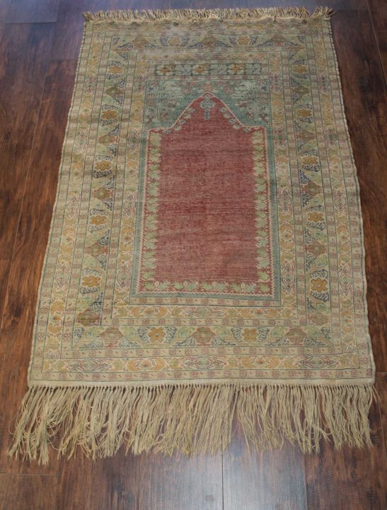 Back of vintage turkish prayer area hand made rug